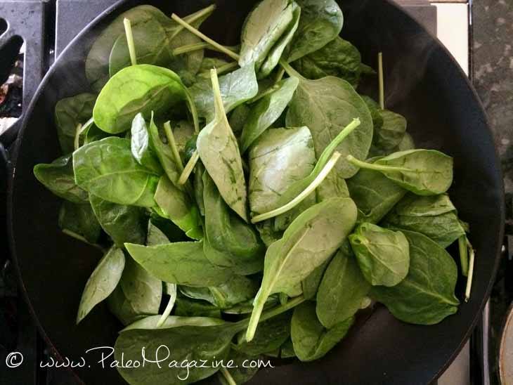 Add in the spinach. If all the spinach won’t fit into the pan, then add some of the spinach, wait for it to cook down, and then add the rest of the spinach in.