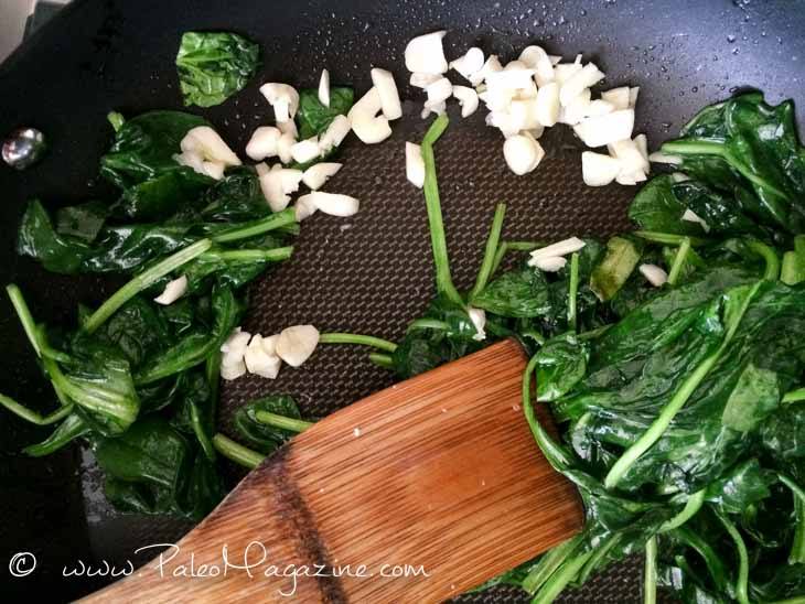 Add in the spinach. If all the spinach won’t fit into the pan, then add some of the spinach, wait for it to cook down, and then add the rest of the spinach in.