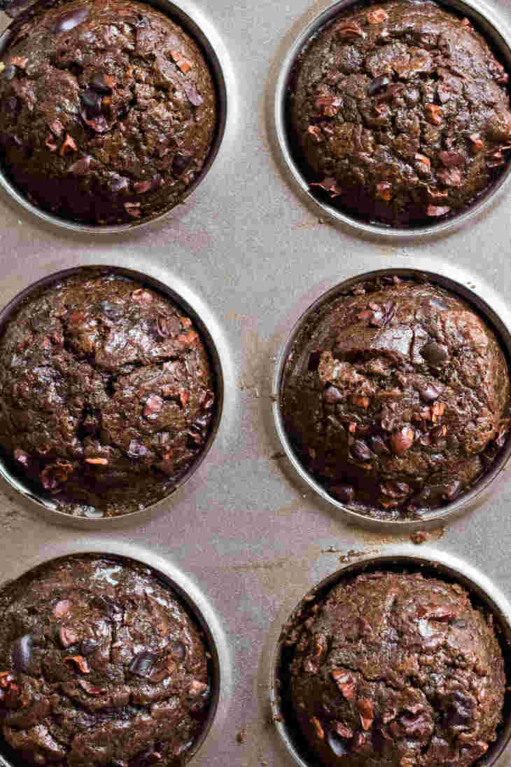 Keto Chocolate Zucchini Muffins Recipe Topped With Cacao Nibs #keto https://ketosummit.com/keto-chocolate-zucchini-muffins-recipe