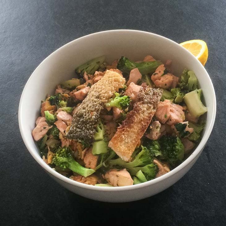 Keto Salmon and Broccoli Saute Recipe Topped with Fried Salmon Skin #keto https://ketosummit.com/keto-salmon-broccoli-saute-recipe